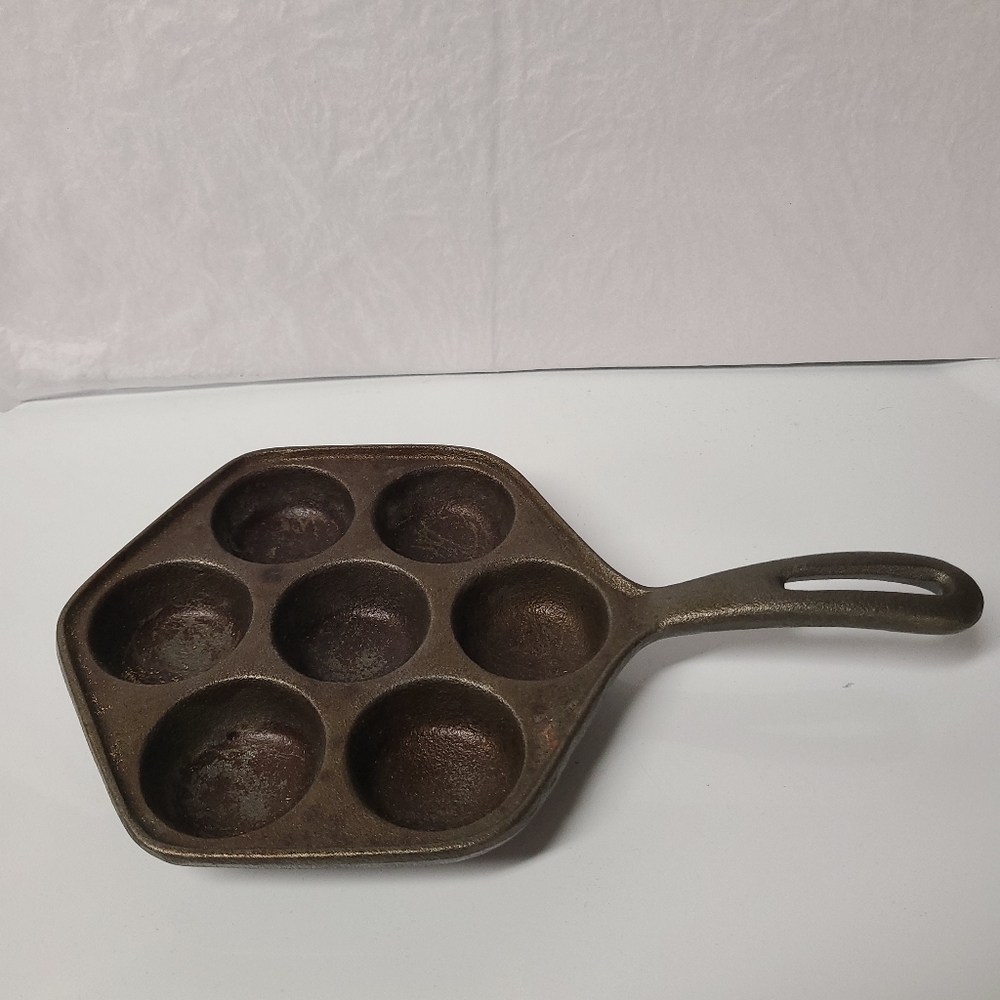 Cast iron muffin pan.  Good condition.